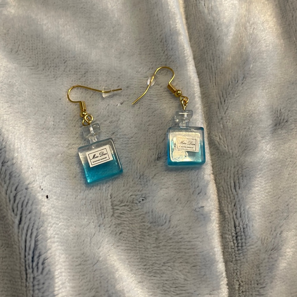 Perfume bottle earrings.